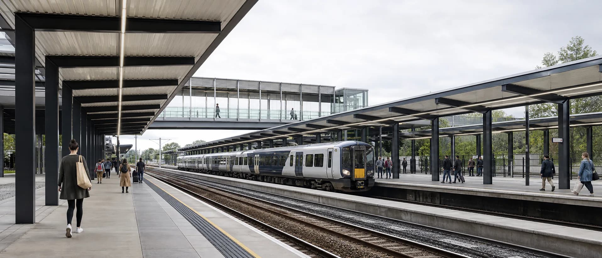 Passengers move through a modern regional station as an unbranded train waits across the platforms.